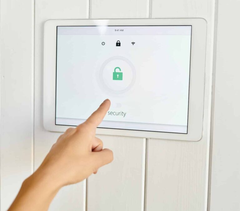 a-hand-pointing-at-panel-of-home-security-appliance.jpg