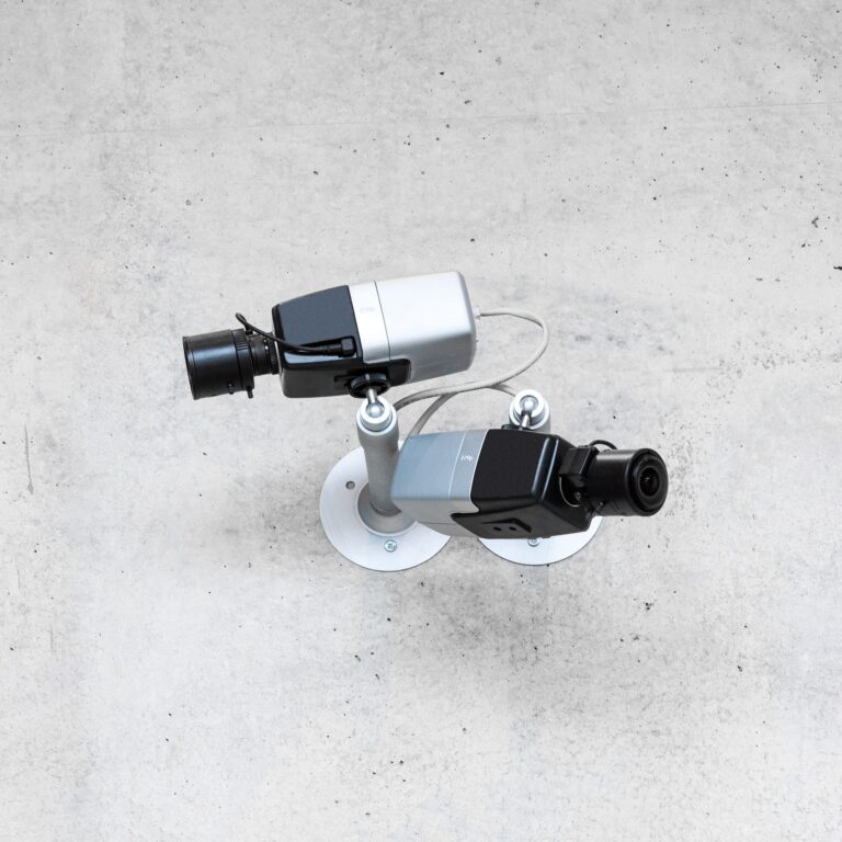 two-modern-cctv-security-cameras-on-concrete-wall.jpg